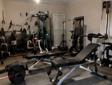 Garden Gym Not Designed Around Equipment Home gym equipment in a garden room showing why layout and space planning matter for a bespoke garden gym