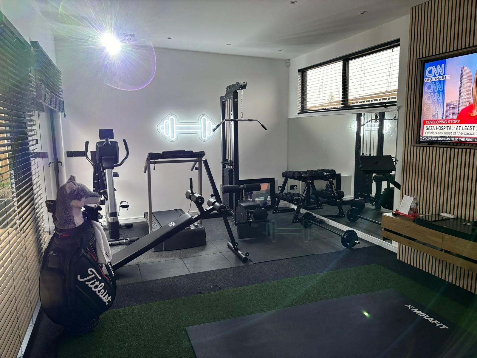 Premium Garden Gym With Equipment Premium garden gym with rubber flooring, gym equipment, wall-mounted TV, lighting and bespoke interior finish