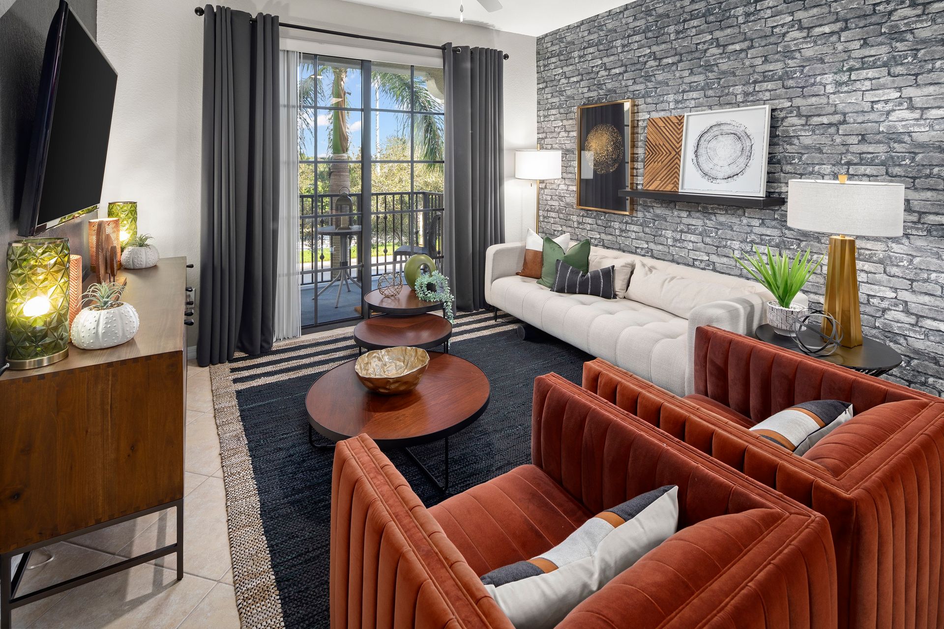 Living room with balcony at Mosaic at Miramar Town Center.