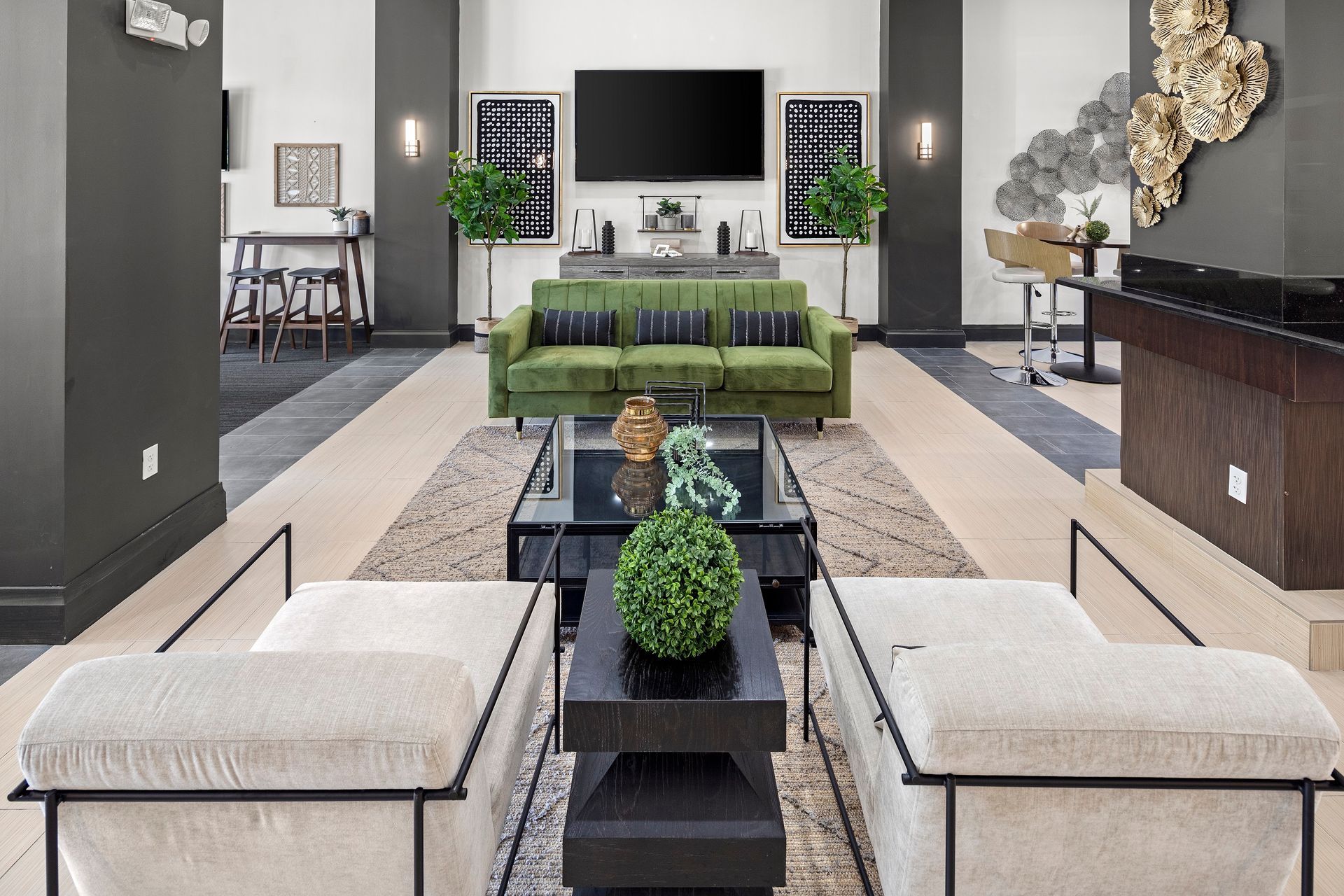 Spacious clubhouse with sofas and TV at Mosaic at Miramar Town Center.