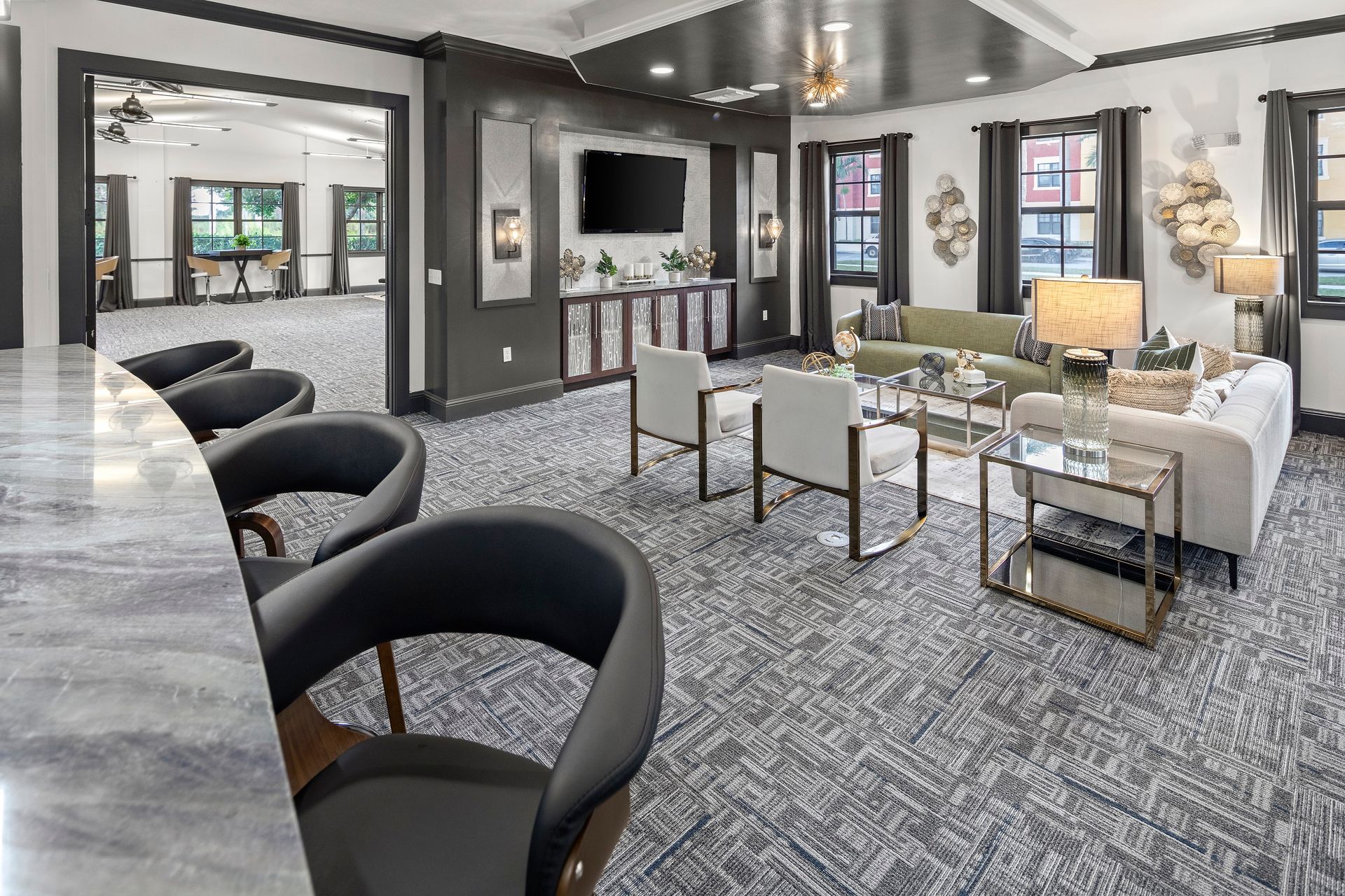Apartment community clubhouse with seating areas at Mosaic at Miramar Town Center.