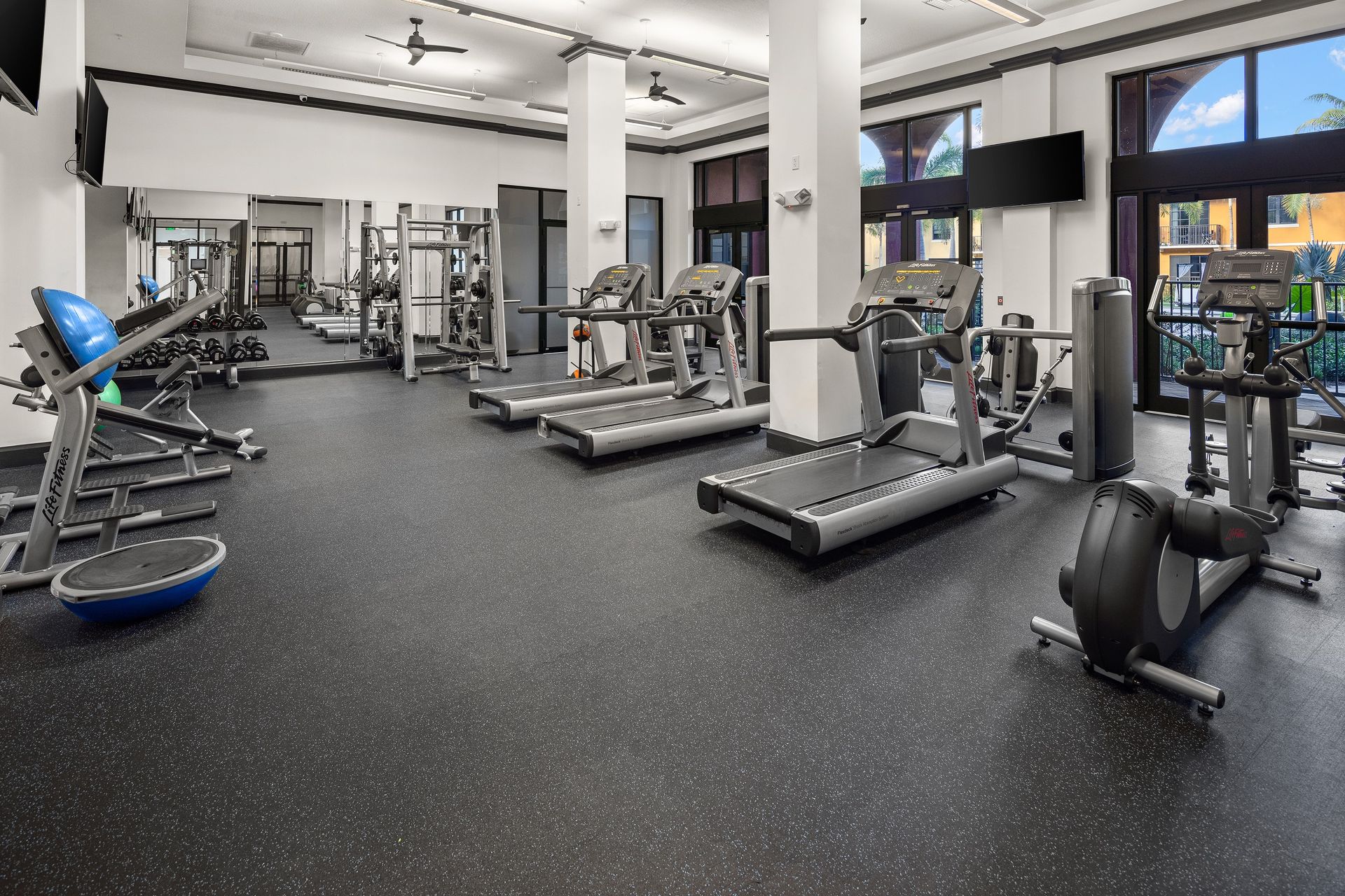 Fitness center with treadmill at Mosaic at Miramar Town Center.