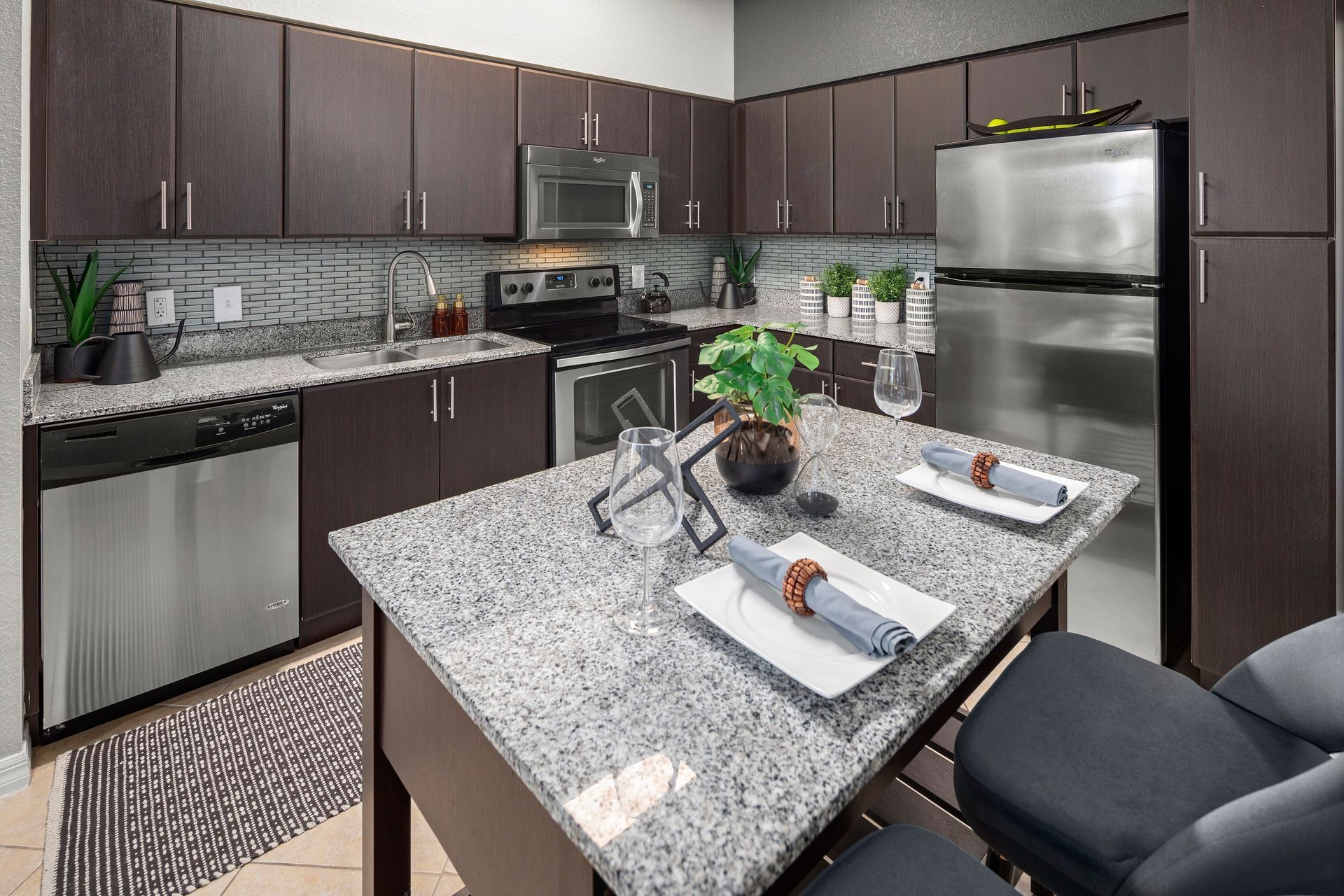 Apartment kitchen with island at Mosaic at Miramar Town Center.