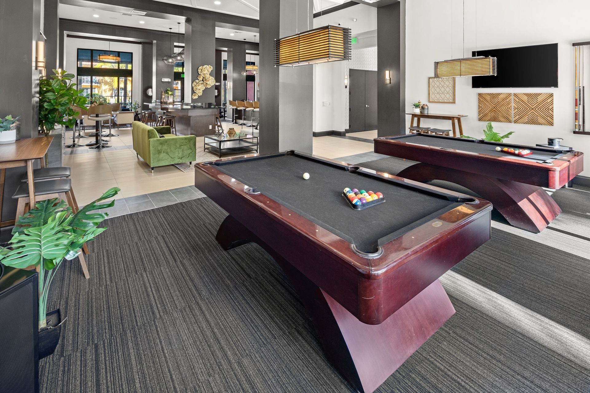 There are two pool tables in the room.
