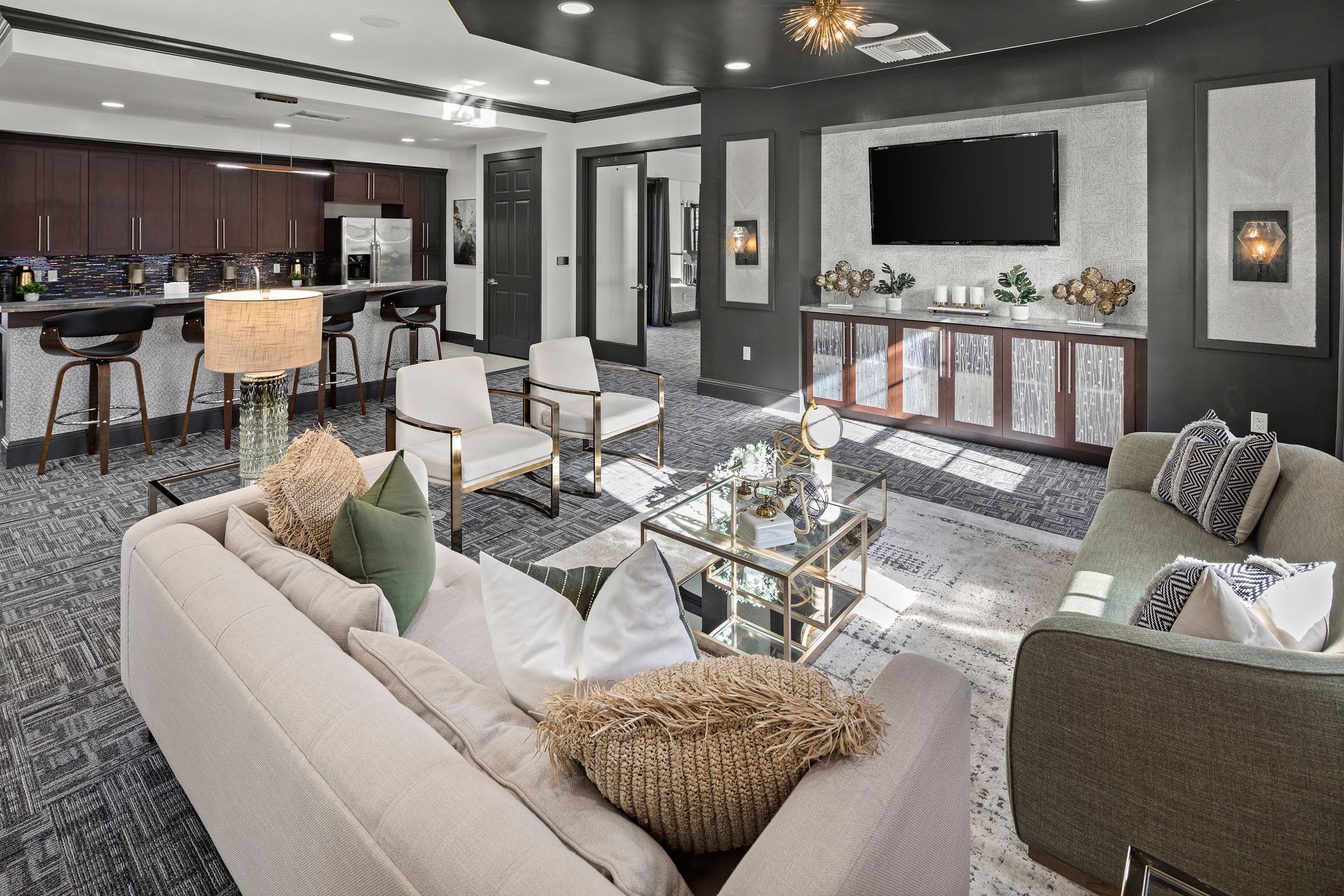 Clubhouse with seating area and TV at Mosaic at Miramar Town Center.