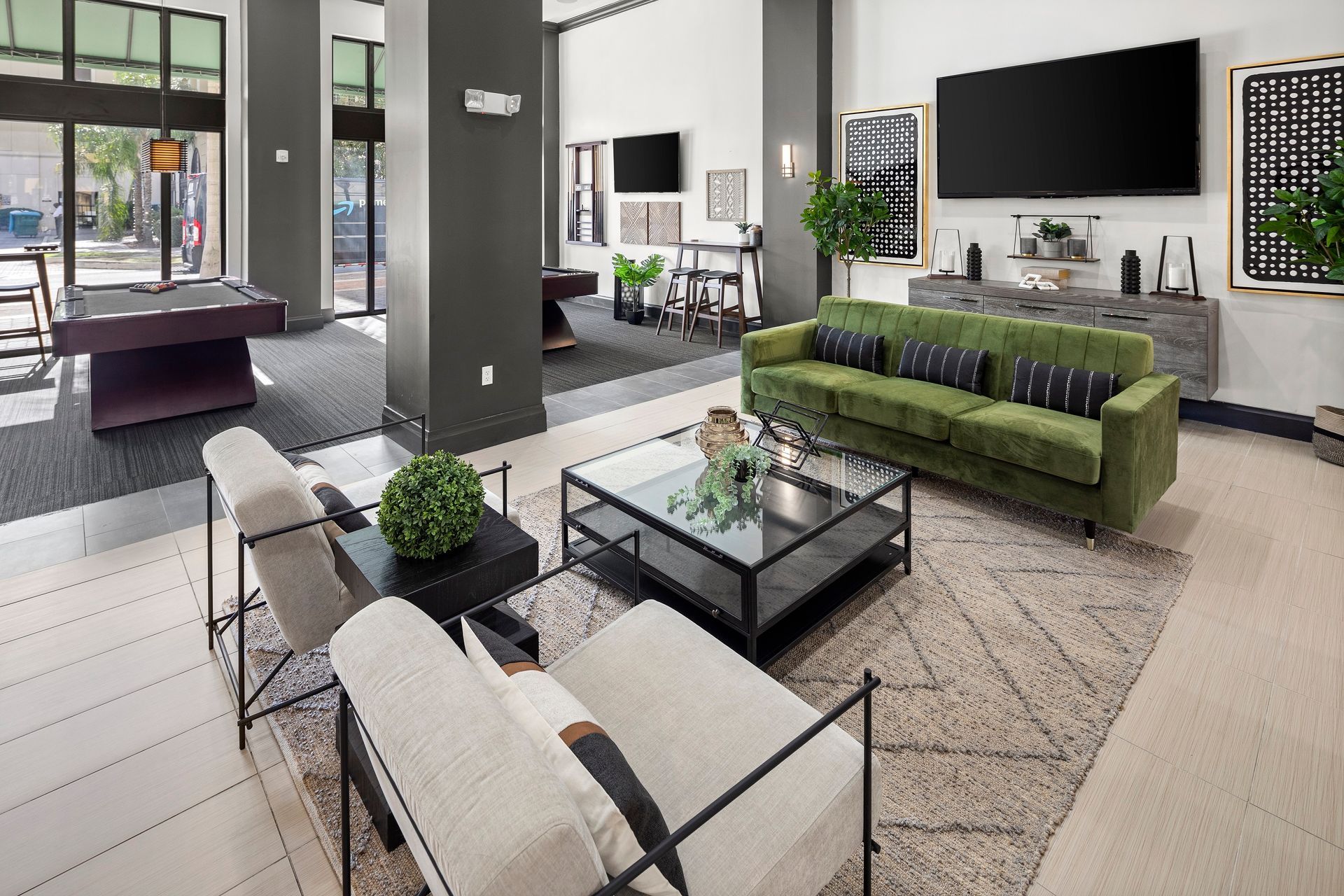 Clubhouse at Mosaic at Miramar Town Center with sofas.