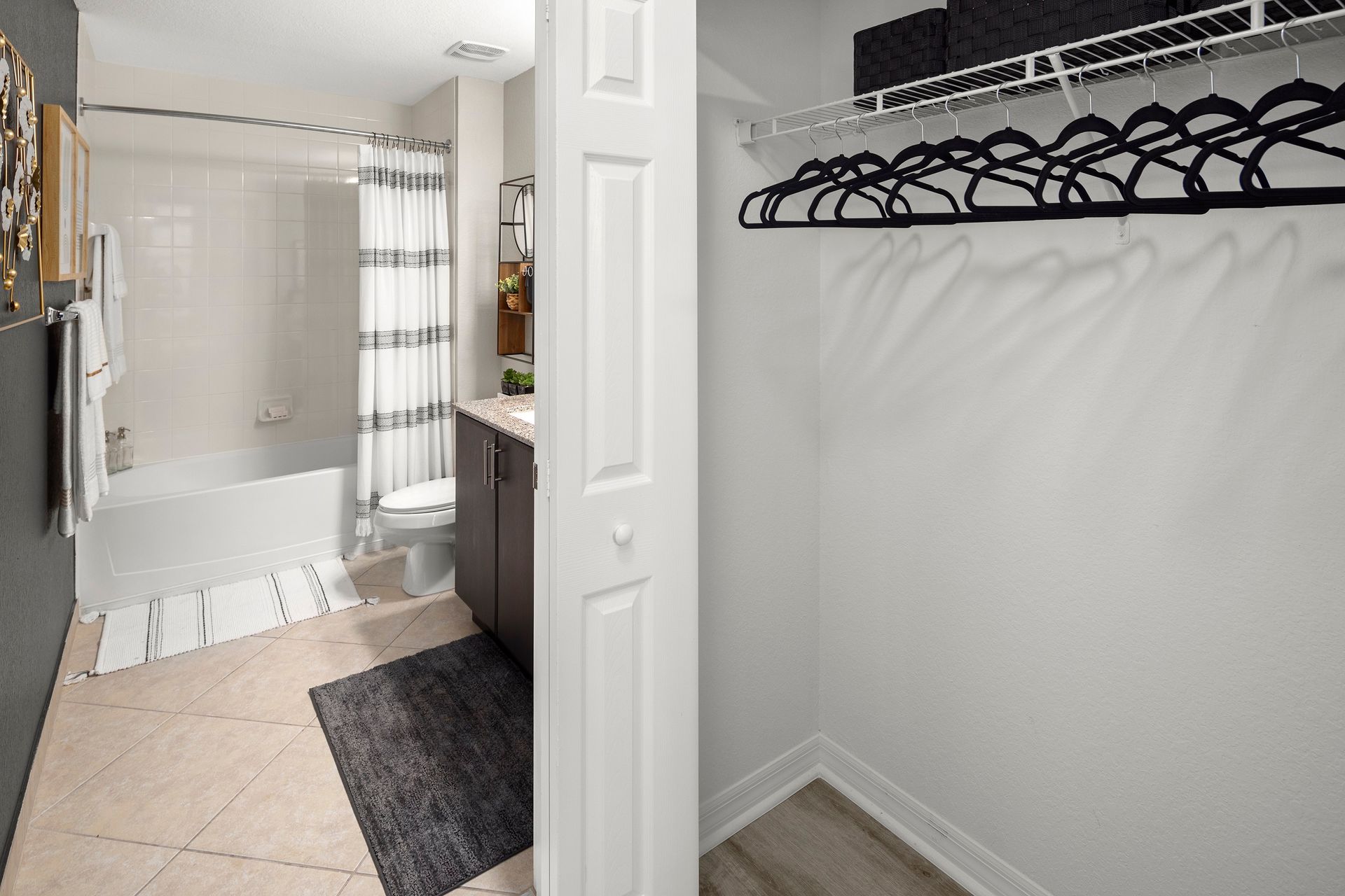 Apartment bathroom at Mosaic at Miramar Town Center with walk-in closet.