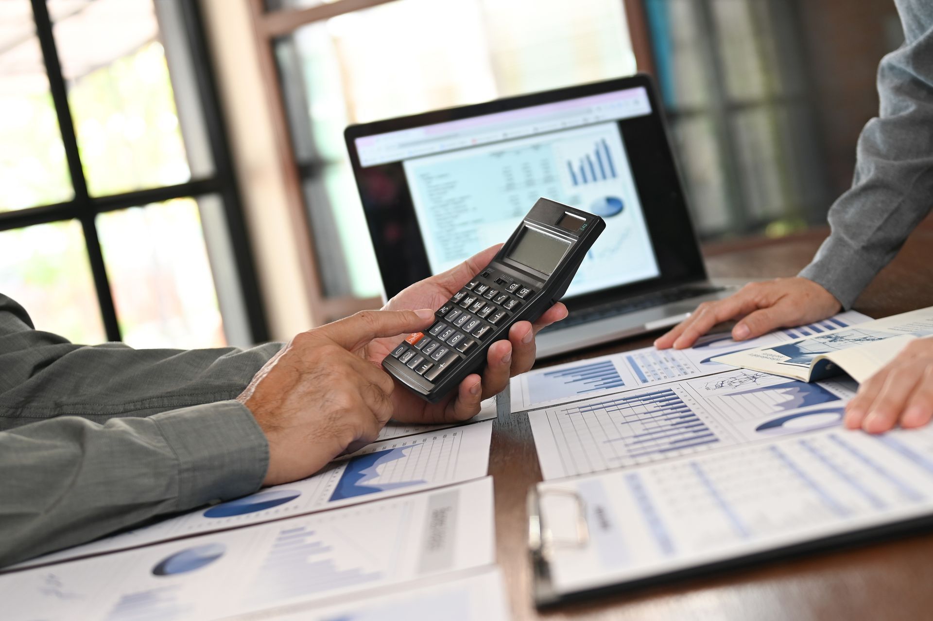 Finance manager calculated capital and preparing budget for financial management.