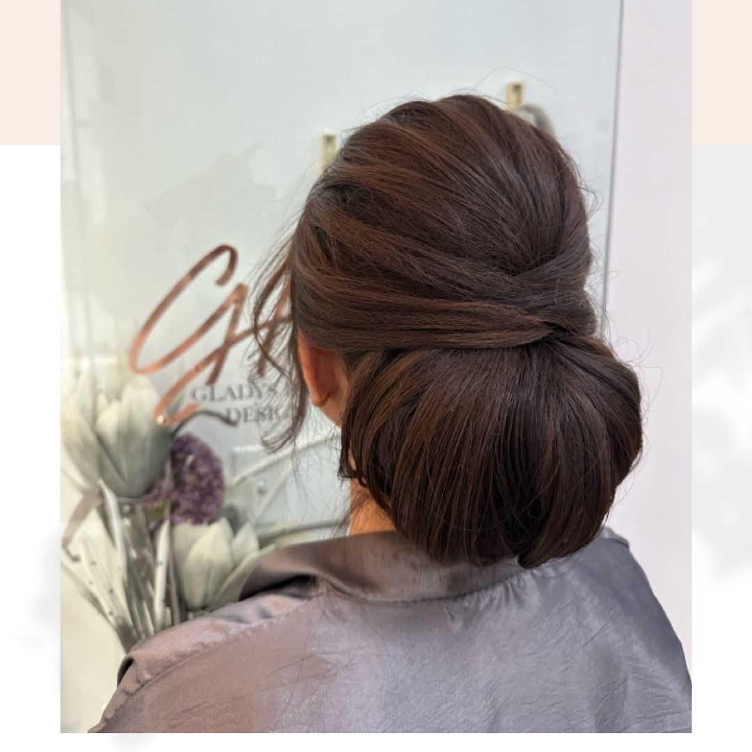 Elegant twisted updo hairstyle at CAH Salon.