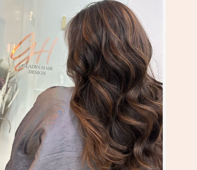 Back view of brunette curls after styling at CAH Salon.