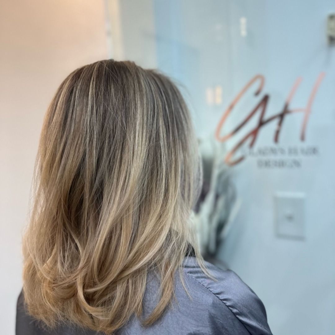 Ash blonde highlights styled at CAH Salon.
