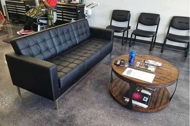 a waiting room with a couch and a coffee table