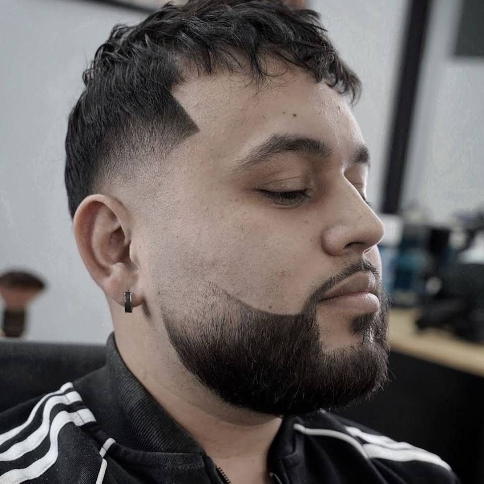 Fade haircut and trimmed beard