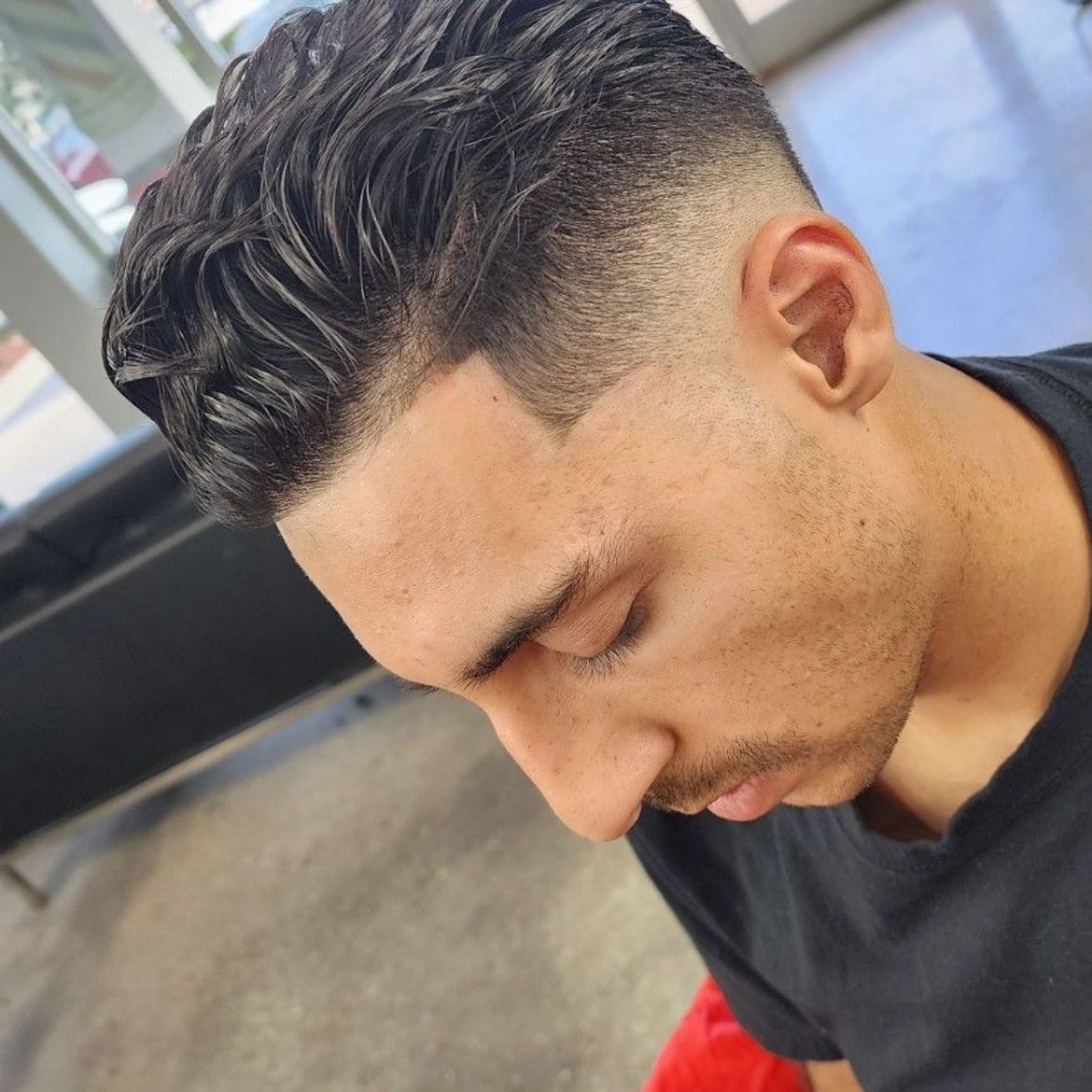 a close up of a man 's face with his eyes closed