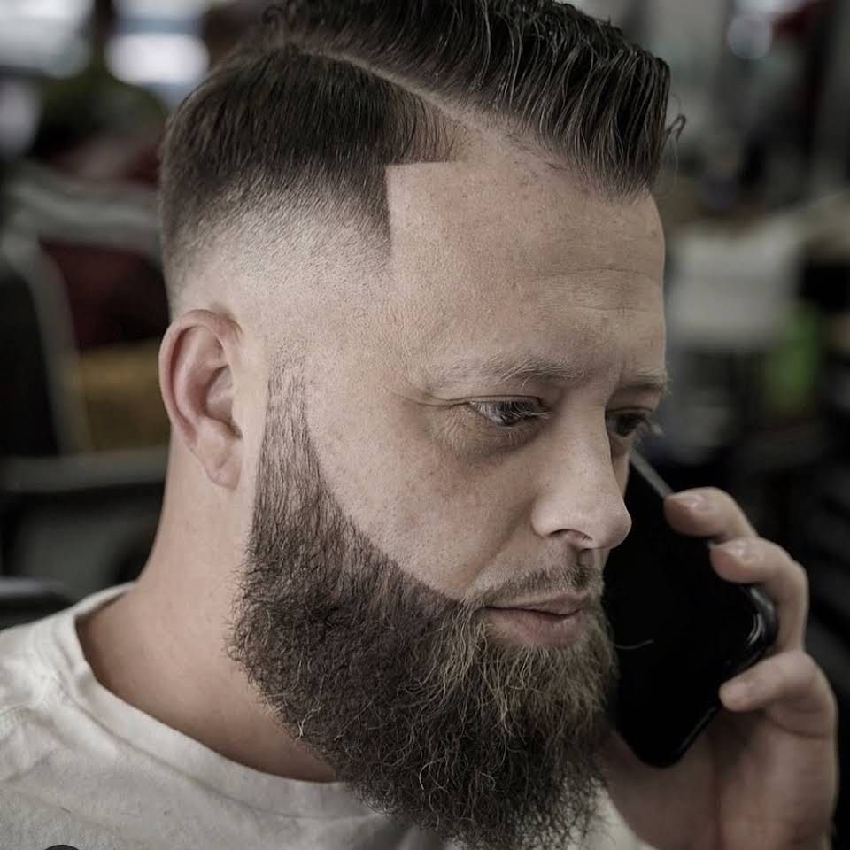 Man on the phone with new haircut