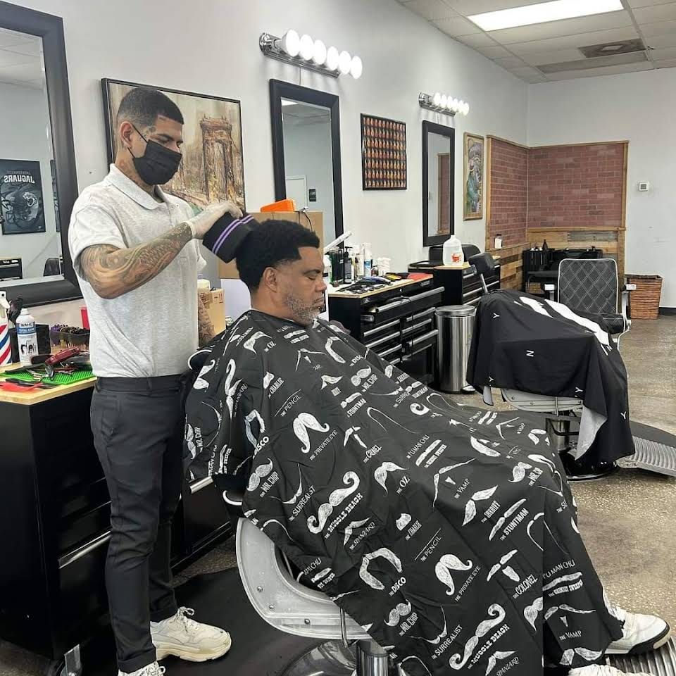 Man sitting in a chair for a new haircut