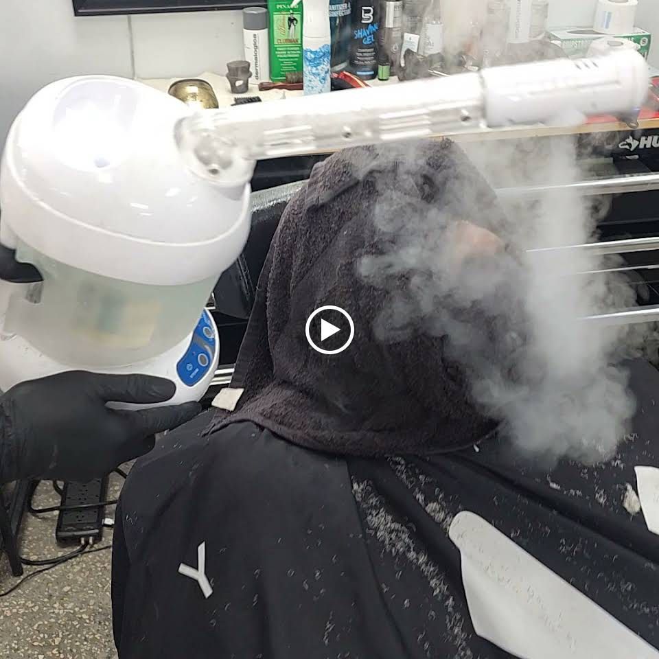 Man with hot towel on the face