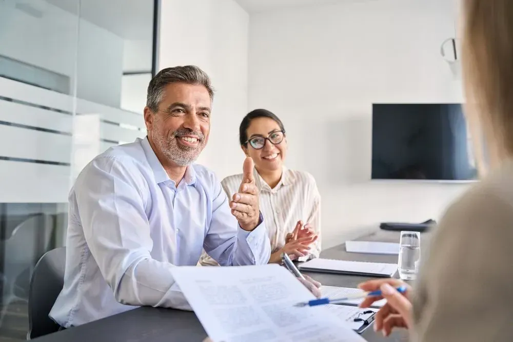 A CFO meets with the CEO of the company to review the financials for the quarter, the CEO is out of frame and is holding a paper and a pen