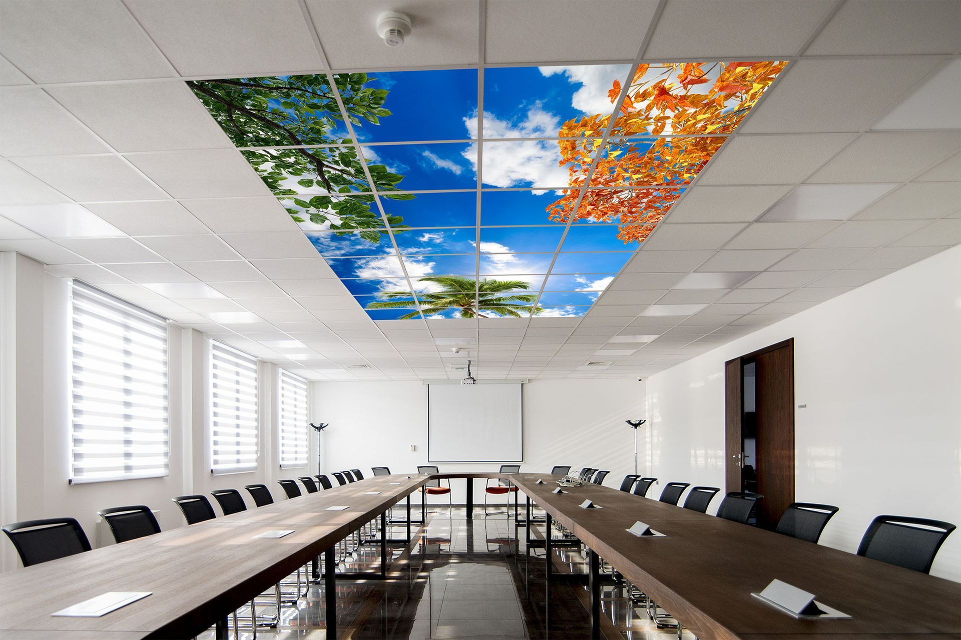 LED sky ceiling panels installed in office meeting room