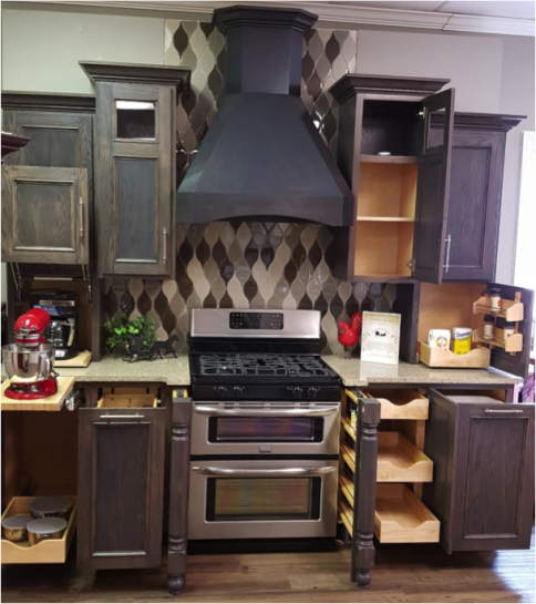 Kitchen with dark wood cabinets, stainless stove and hood, and a black-and-white diamond tile backsplash.