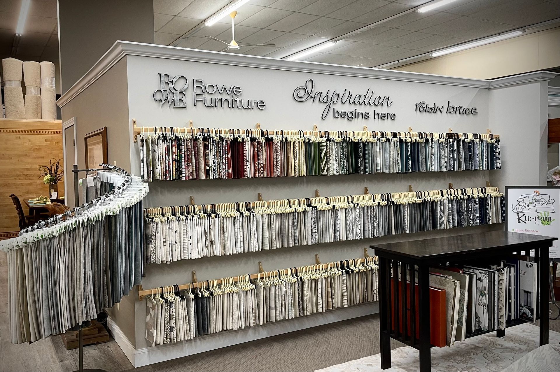 Retail display of hanging yarn skeins on wall shelves in a fabric store