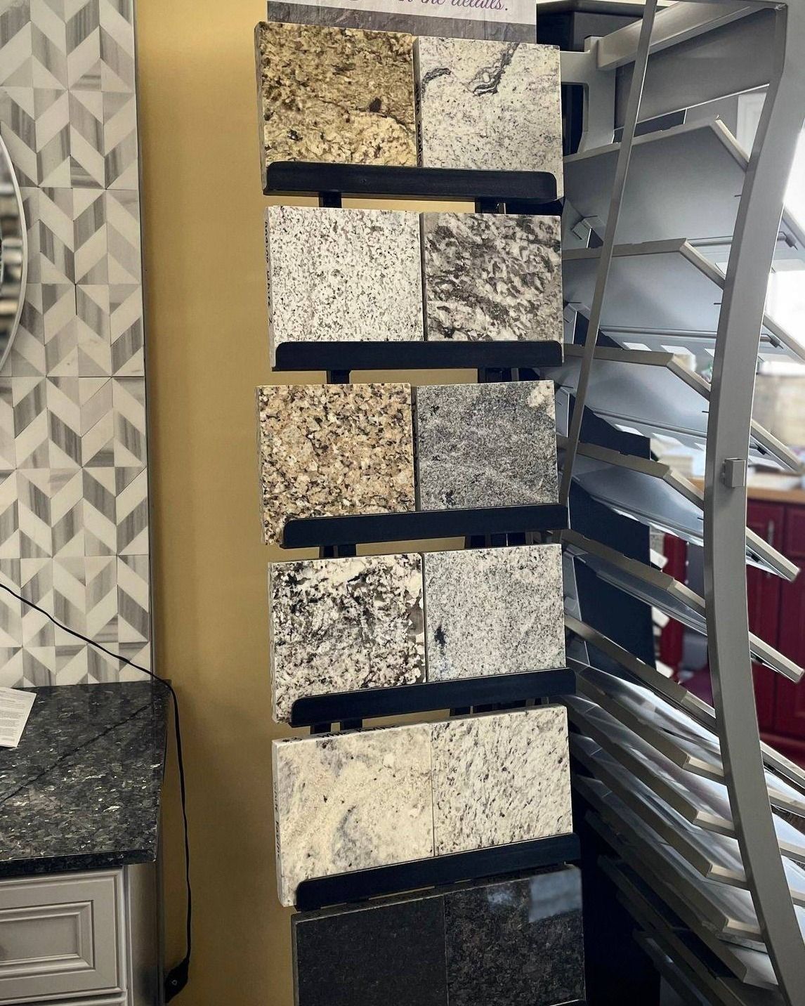 Granite slab display rack with stacked stone samples in a showroom