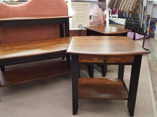 Wooden bench and matching coffee table in a furniture store showroom.