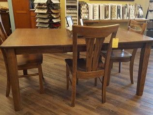 Wooden dining table with chairs in a cozy café or library setting