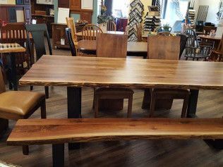 Wooden tables and benches in a furniture store showroom