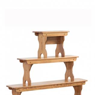 Three-tier wooden display shelf with natural wood finish on a white background