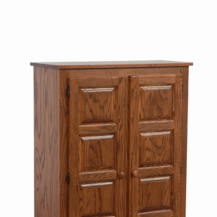 Small wooden cabinet with double paneled doors and a dark top, on a white background