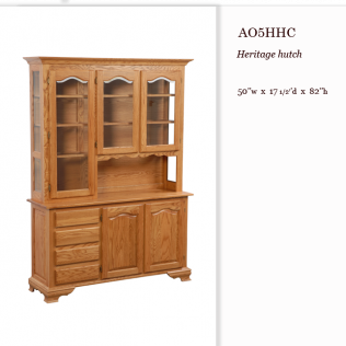 Oak heritage hutch with glass-front upper cabinets and lower drawers in a wood finish.