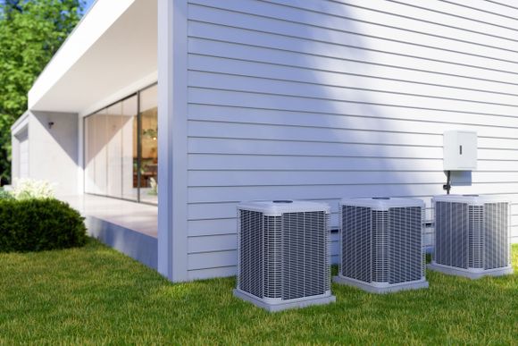 House Exterior with Air Heat Pumps in the Backyard — Nicholasville, KY — Stewart Air Conditioning & Heating