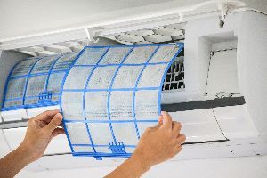 Man Hand Holding an Air Conditioner Filter — Nicholasville, KY — Stewart Air Conditioning & Heating