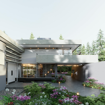 Modern home with a concrete facade, a balcony, and a lush garden.