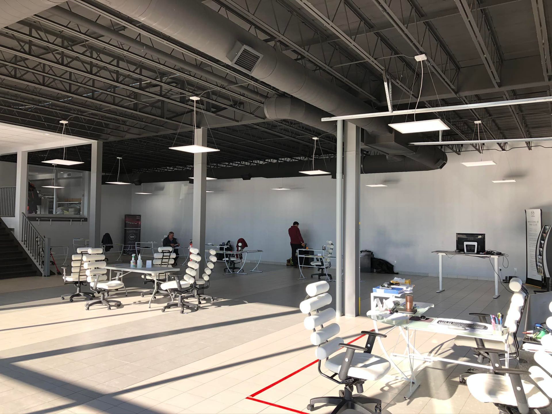 A large room with tables and chairs in it