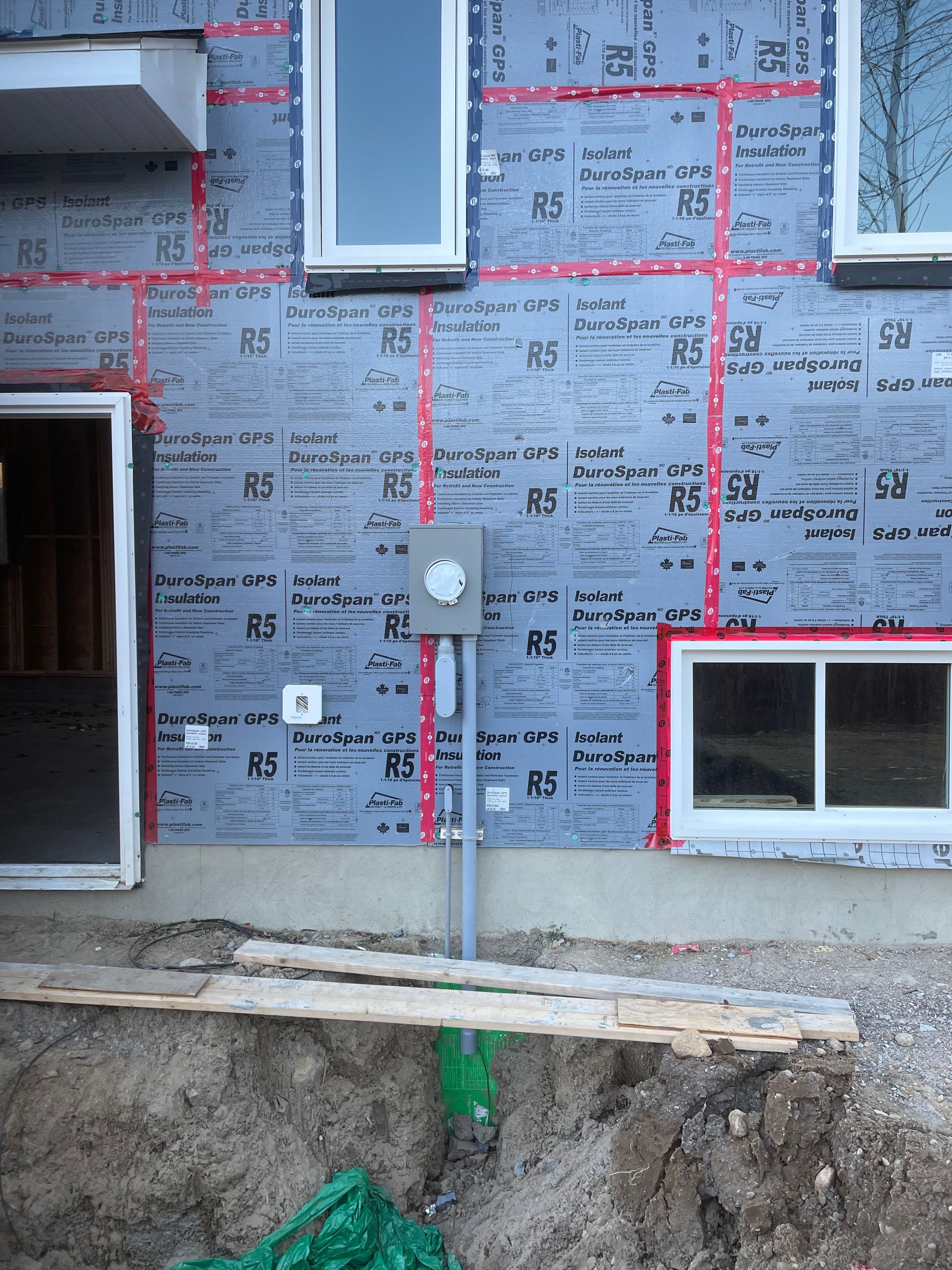 A house is being built and the letters rs are on the wall