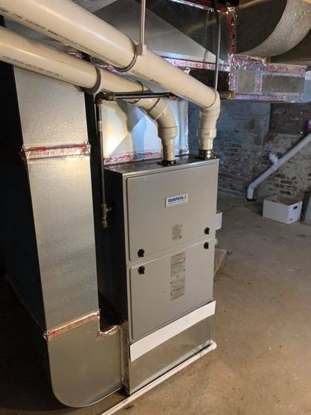 a heating and cooling system is installed in a basement .