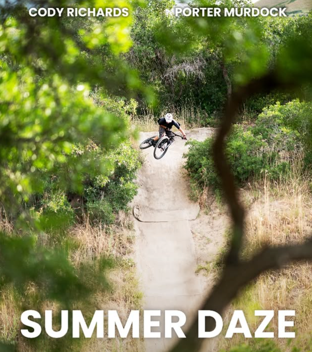 biking going down road with text