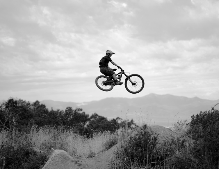 black and white photo bike in the air