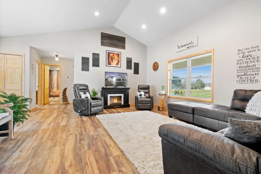 A living room filled with furniture and a fireplace.