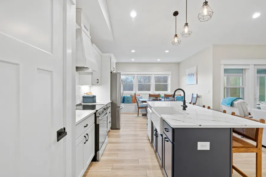 There is a large island in the middle of the kitchen.