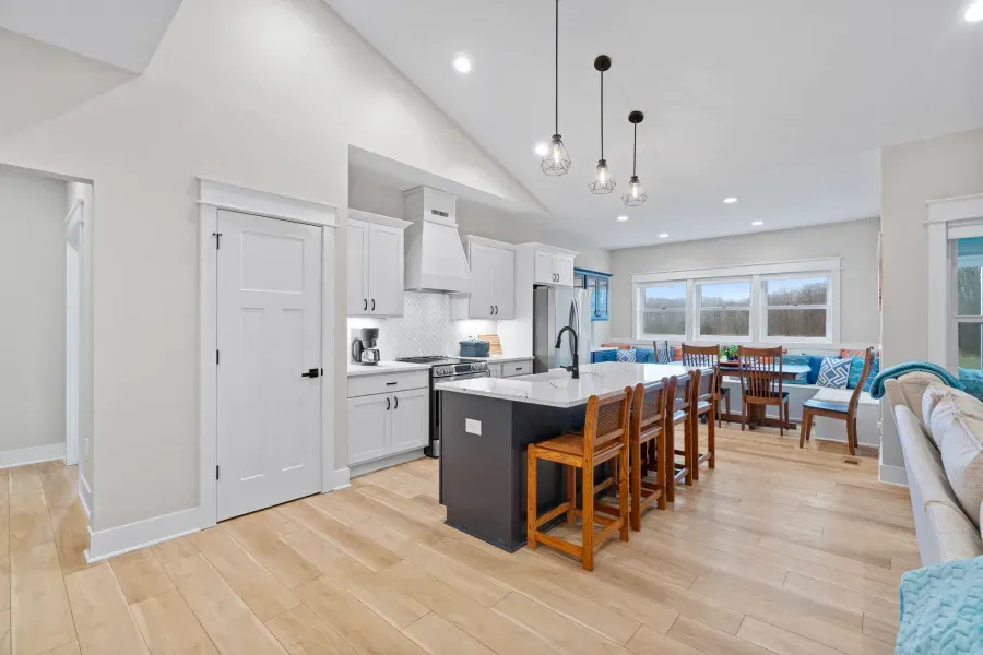 A kitchen with a large island in the middle of the room.