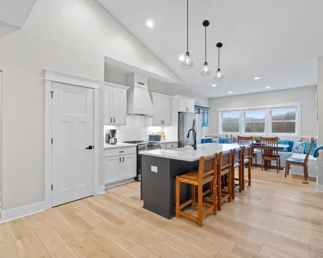 A kitchen with a large island in the middle of the room.