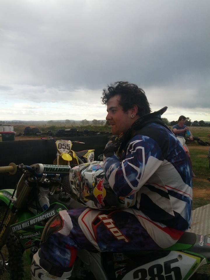 man sitting on his bike