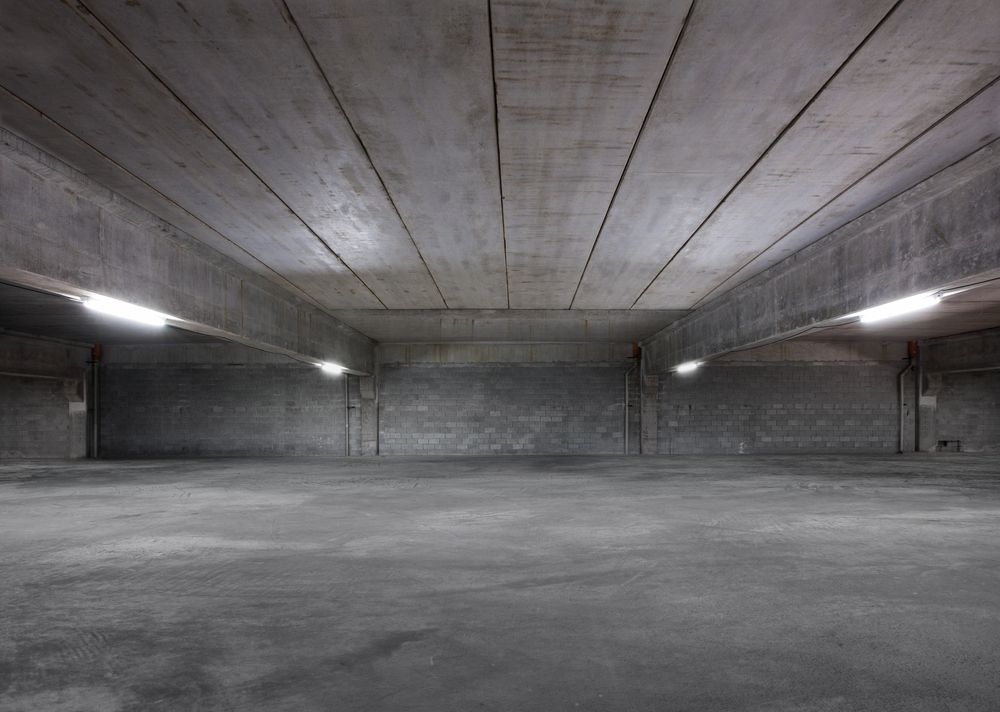 Empty, Concrete Parking Garage with Grey Walls, Ceiling, and Floor — Complete Sheds In Bowral, NSW