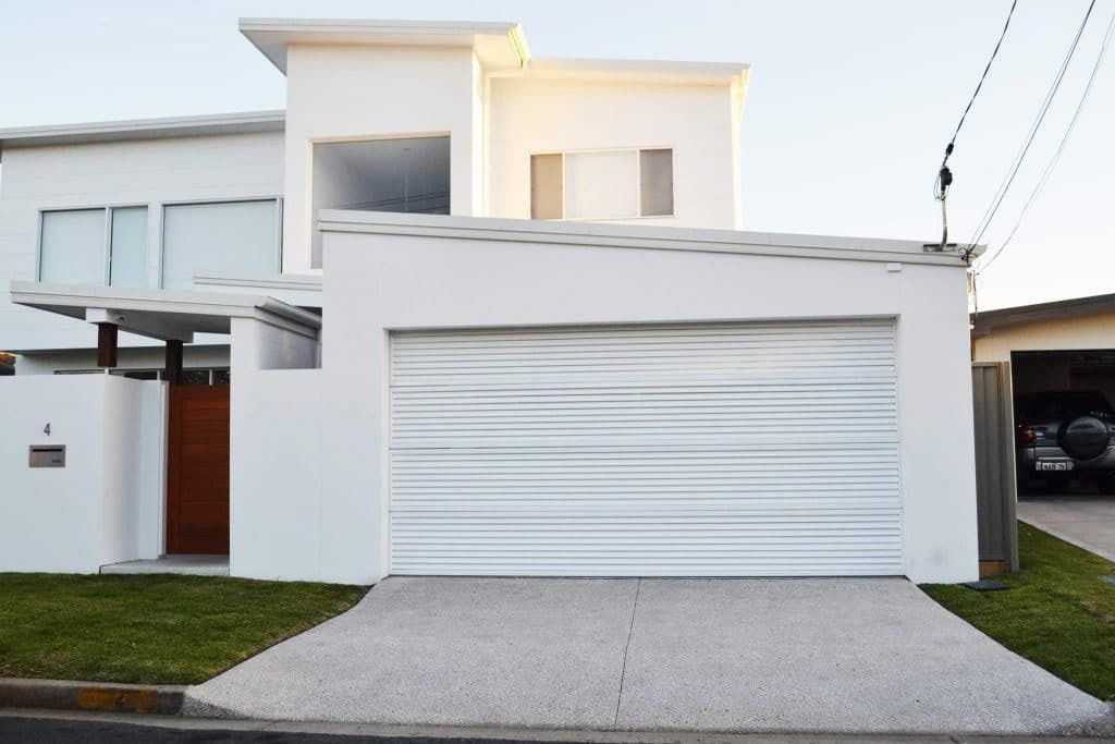 A White House With A White Garage Door — Gold Coast Door Centre In Burleigh Heads, QLD