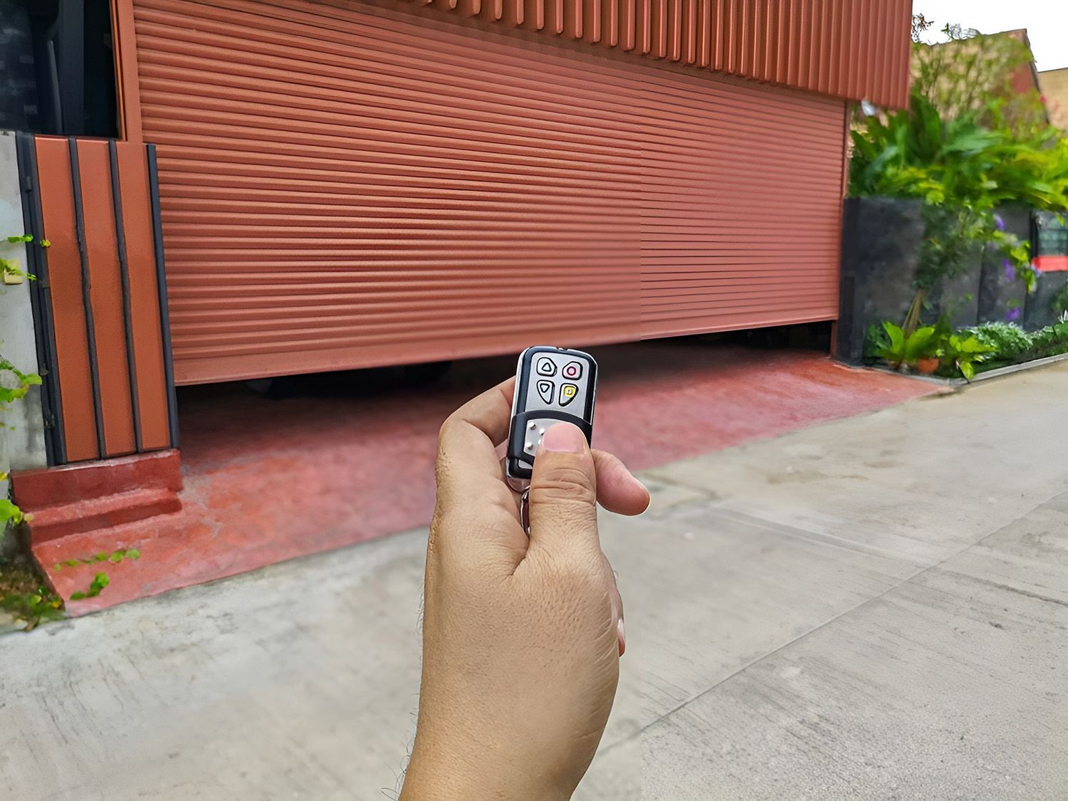 Hand Holding Remote, Controlling A Garage Door