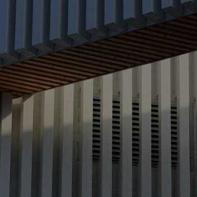 A close up of a building with a wooden ceiling.