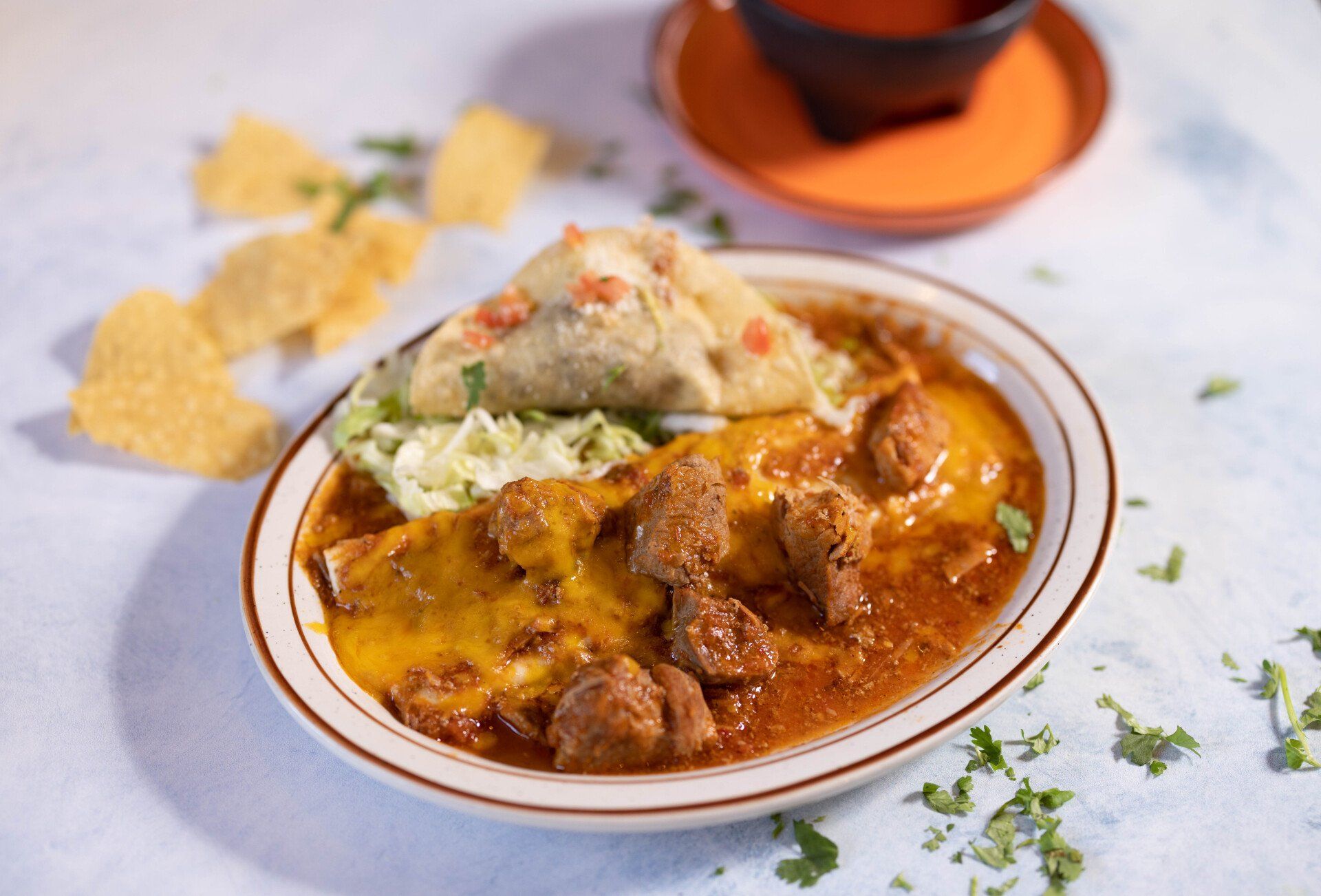 Pork and Bean Burrito spread and a fried taco